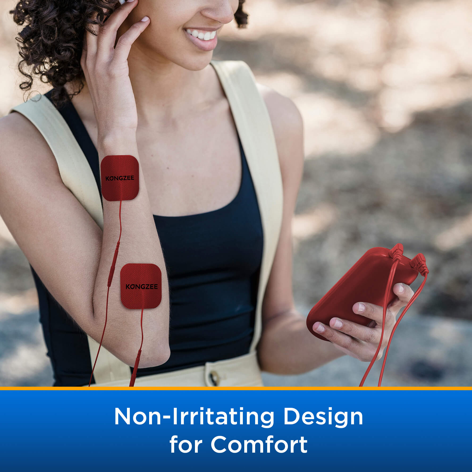 Woman using red reusable TENS electrode pads on arm for comfortable pain relief featuring non-irritating design